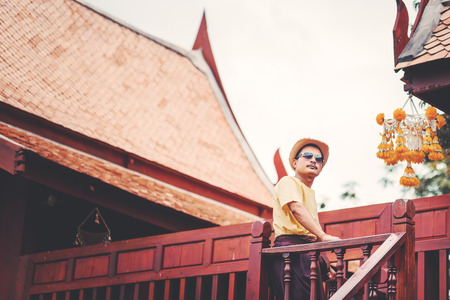 A man stand in the house thai style between travel.の写真素材