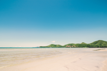 Beach, sea, sky and mountainsの写真素材