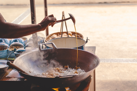 chef make Fried rice sticks with shrimp in street food.の写真素材