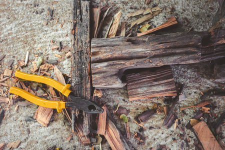 Yellow pliers on the groud.の写真素材