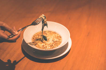 People use fork for pick Spinach cheese in the dish in the resraurant.