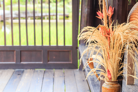 Golden dried rice flower in the vase for home decoration.の写真素材