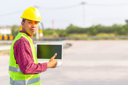 Foreman use computer for test and checking vehicle at industry. Working concept.