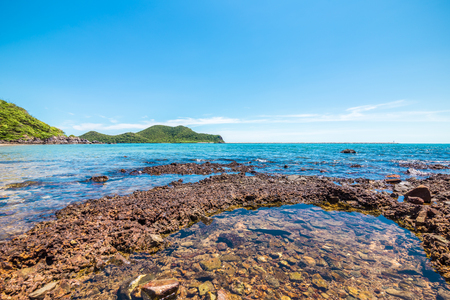 The rock in the sea water and mountain back. Seascape Concept.の写真素材