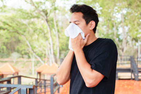 Man wiping off the sweat in the parks.の写真素材