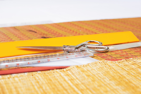 Scissors and ruler on the ground.の写真素材