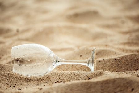wine Glass on sand in the beach.の写真素材