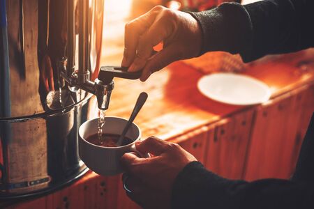 A man hands make a coffee in the morning.の写真素材
