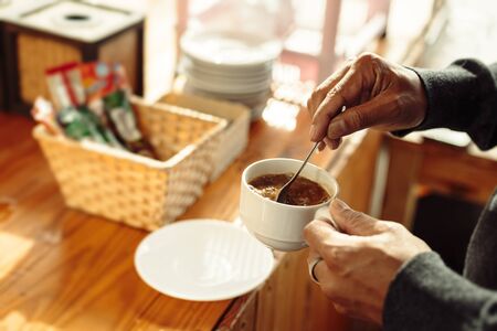 A man and coffee cup in the morning.の写真素材