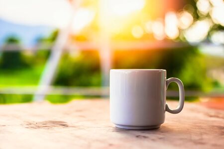 A cup of coffee on the table in the morning.の写真素材