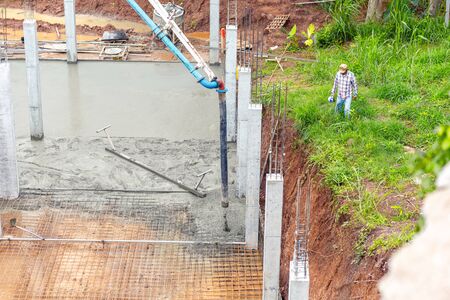 Project manager walking around site construction for checking.の写真素材