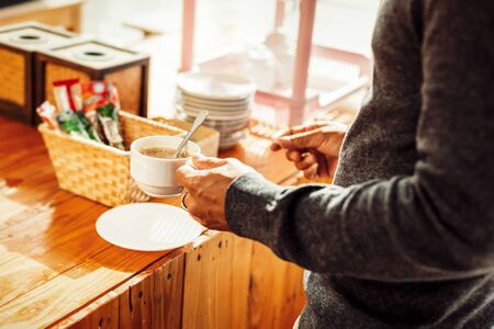 A man and coffee cup in the morning.の写真素材