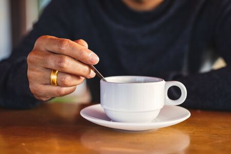 hot cup of coffee on the wood table in the morning.の写真素材