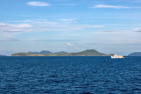 yacht in the blue ocean and mountain and blue sky.の写真素材