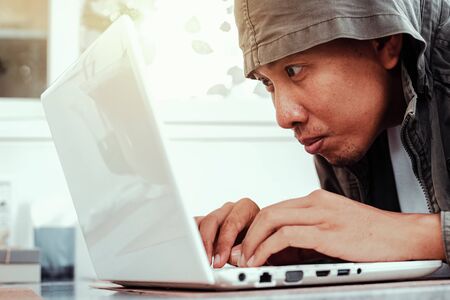 Hacker use laptop for hacking data.の写真素材