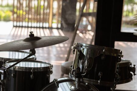 Modern drum set on stage prepared for playing.の写真素材