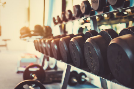 Dumbells set for a exercise in the fitness gym.の写真素材