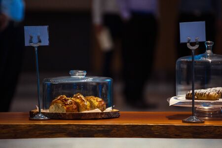 Bread is on the cutting board in the restaurant.の写真素材