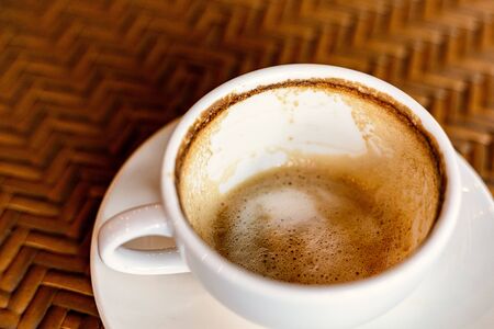 Empty coffee cup after drink on wood table.の写真素材