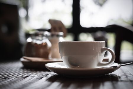hot cup of coffee on the wood table.の写真素材