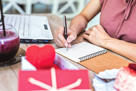 Hand writing short memories note on paper with relaxing time.