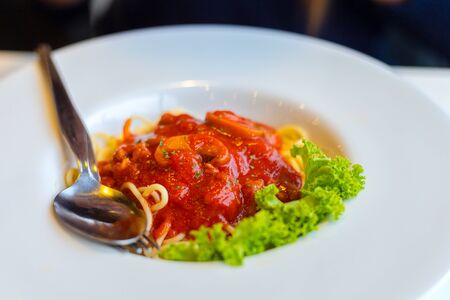 Pasta, spaghetti with tomato sauce in white bowl.の写真素材