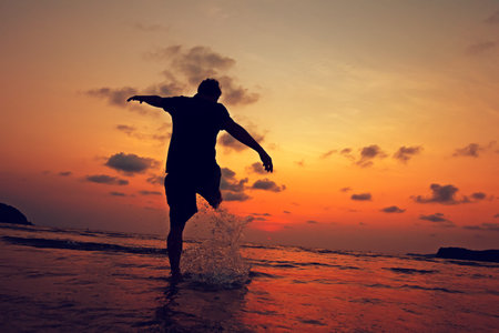 summer and travel, landscape by the sea and sunset. kicked the water splash .