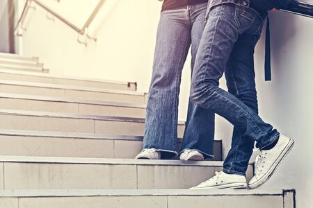 college student stand on the staircaseの写真素材