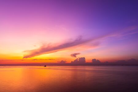 Sea and sunset with beautiful cloud at twilight. Seascape background.の写真素材