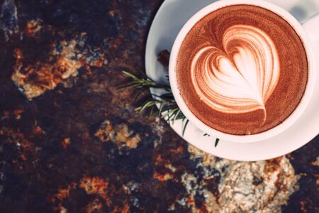 Latte Art Heart on a stone  background.の写真素材