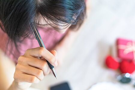 Women hold pen and reaction thinking.の写真素材