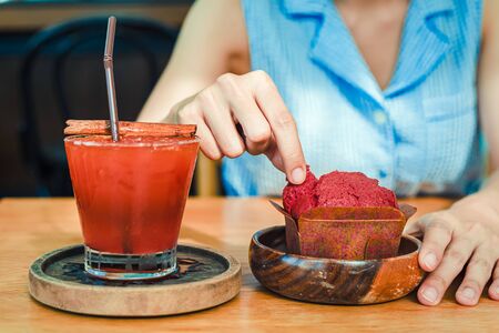 A women and muffin strawberry.の写真素材