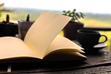 Open book on the table in the morning.の写真素材