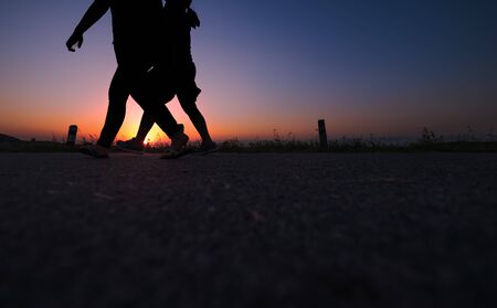 silhouette people waking in the park.の写真素材