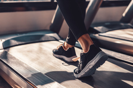Fitness women running on track treadmill, exercise fitness. Fitness, gym, workout and lifestyle...