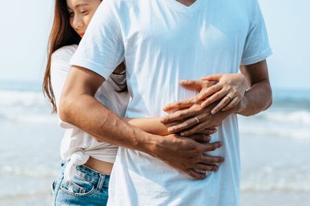 Romantic couple having love and hug on the beach.の写真素材