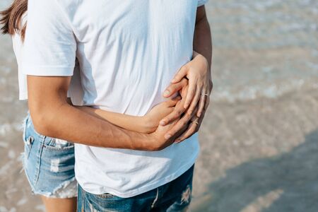 Romantic couple having love and hug on the beach.の写真素材