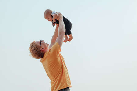 Happy family on the beach.  Father, mother and baby having fun on summer vacation. Holiday travel conceptの写真素材