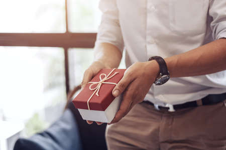 christmas, valentine, holidays gift box concept. Couple surprise gift box together.の写真素材