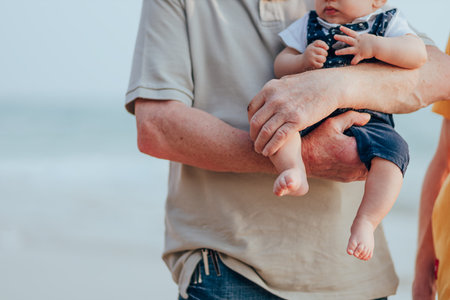 Happy family on the beach.  Father, mother and baby having fun on summer vacation. Holiday travel...
