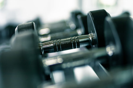 dumbbell set. Close up dumbbells on rack in sport fitness.