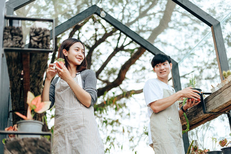 Woman hold cactus. Love couple enjoy hobby with garden cactus.
