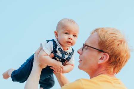 Happy family on the beach.  Father, mother and baby having fun on summer vacation. Holiday travel conceptの写真素材