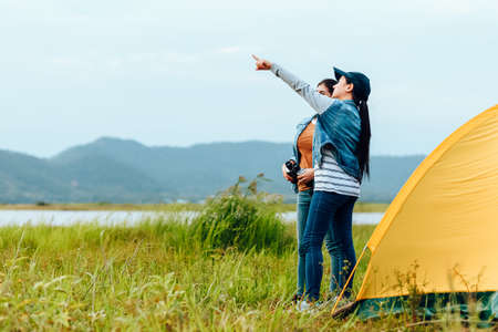 A group of friends travel and camping near lake and mountain back.の写真素材