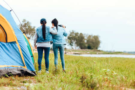 A group of friends travel and camping near lake and mountain back.の写真素材