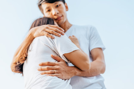 romantic couple hug together on the beach at summer. Honeymoon, travel, holiday, summer concept.