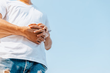 romantic couple hug together on the beach at summer. Honeymoon, travel, holiday, summer concept.の写真素材