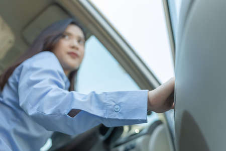 Close up of hand businesswoman close a car door.の写真素材