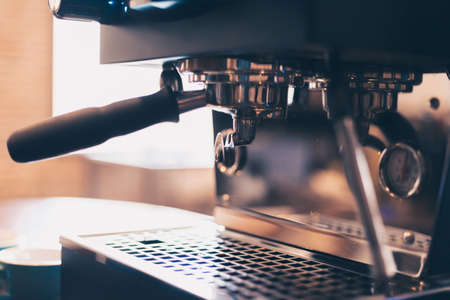Barista cafe making coffee with coffee machine. Coffee preparation service concept.の写真素材