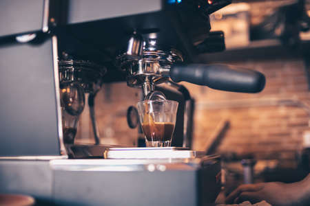 Barista cafe making coffee with coffee machine. Coffee preparation service concept.の写真素材